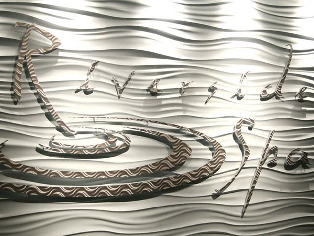 Artistic wavy wall design featuring the Riverside Spa logo in elegant script.