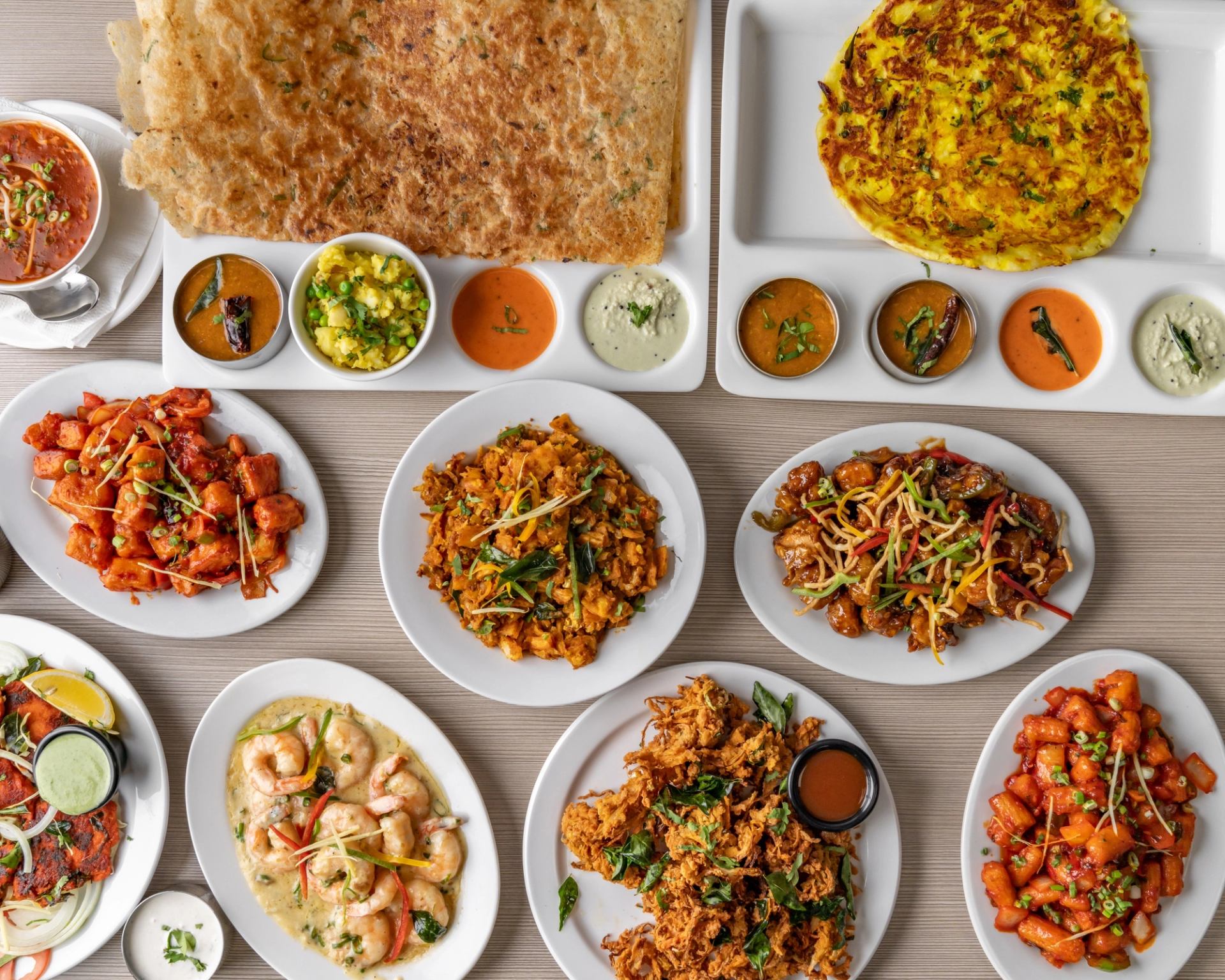 Indian dishes with flatbreads, curries, shrimp, fried appetizers and dipping sauces.