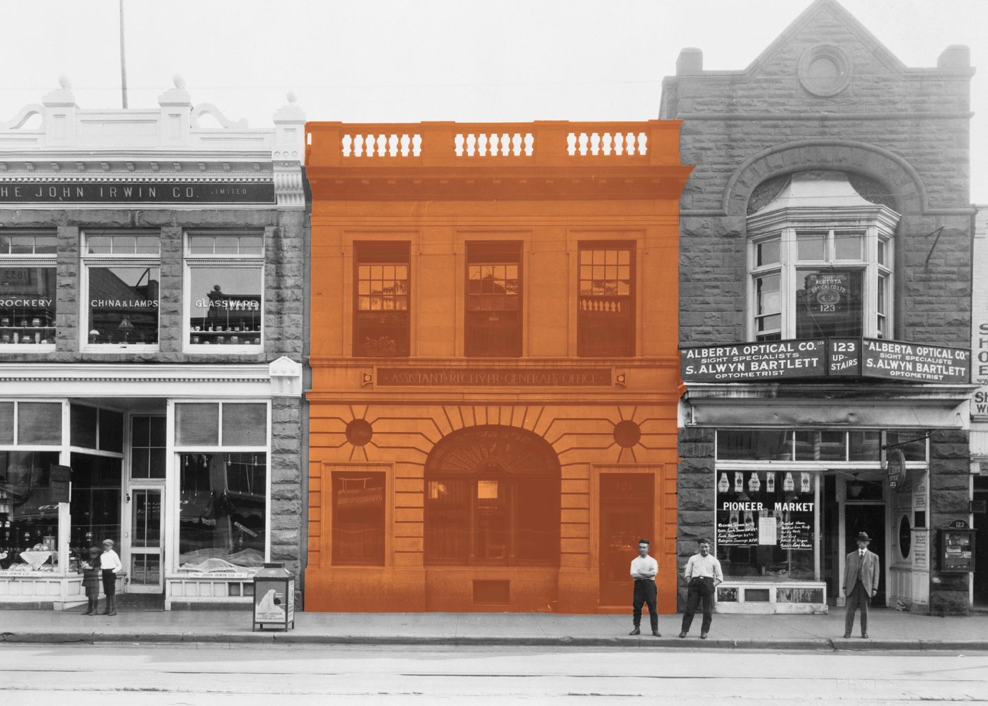 Historic streetscape with central building highlighted in orange and people standing outside.