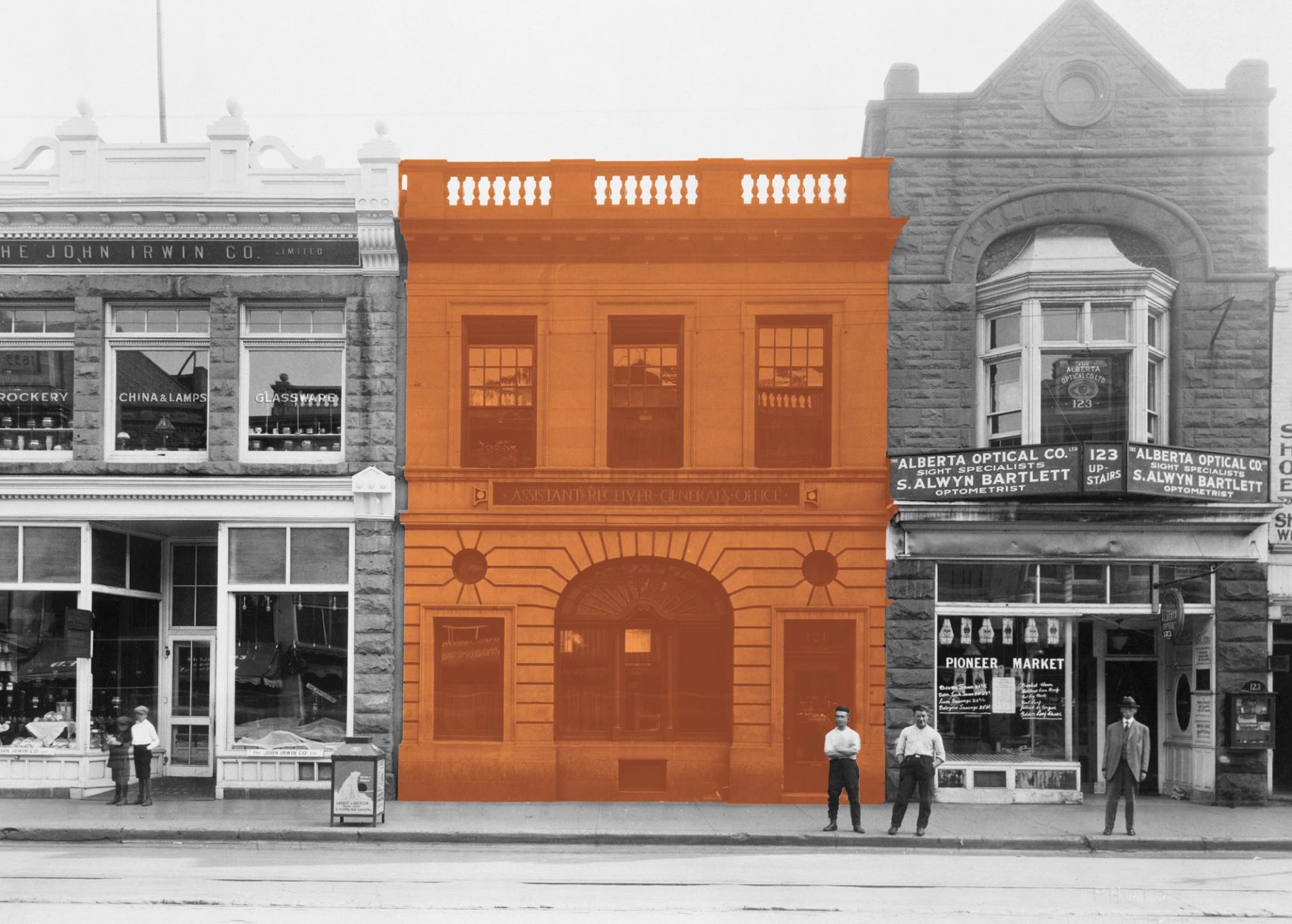 Historic streetscape with central building highlighted in orange and people standing outside.