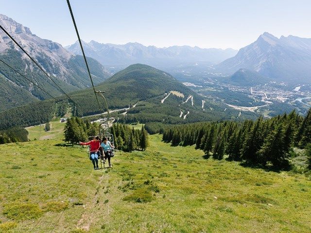 Friends enjoying the sights from the Mt Norquay Banff Sightseeing Chairlift.