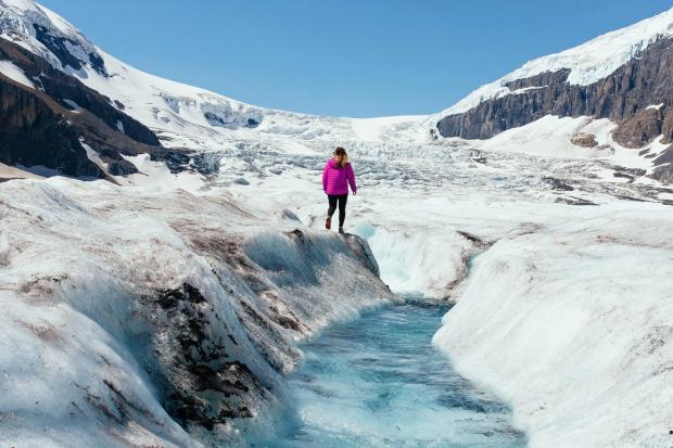 Hiker on the Athabasca Glacier in the Columbia Icefields.