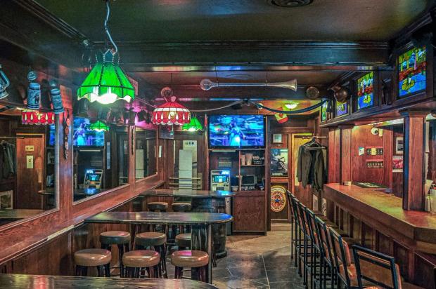 Chairs and bar inside the pub