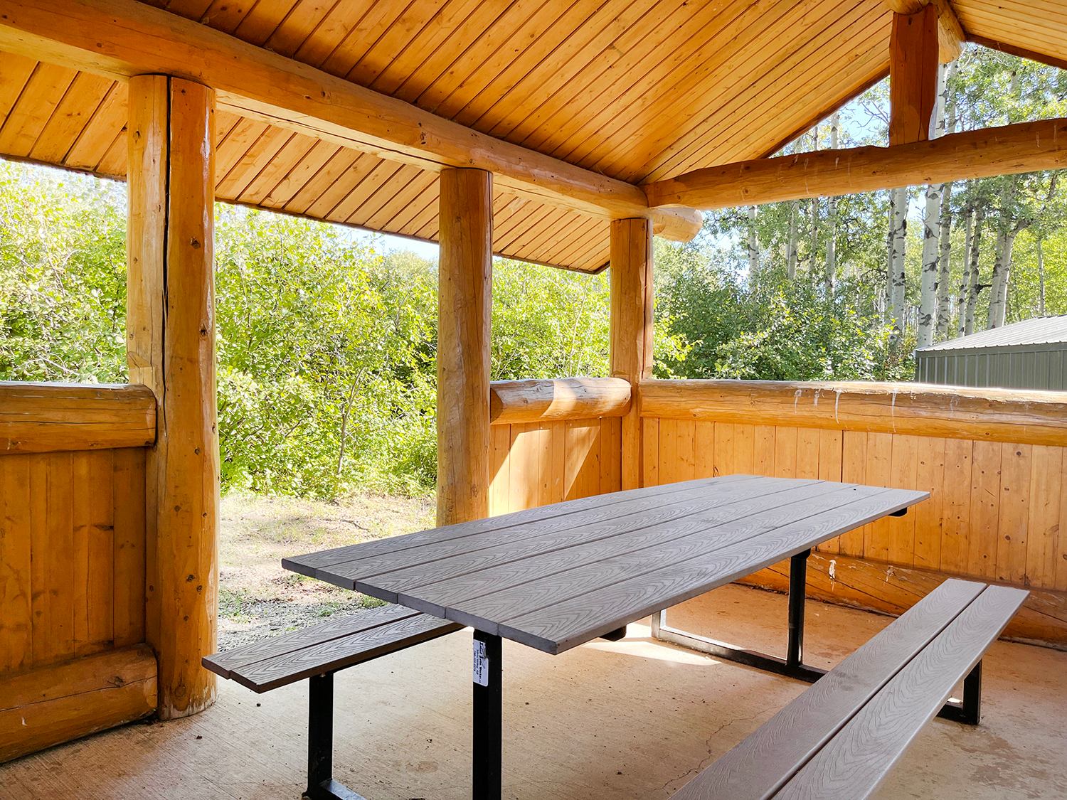 An open shelter with a picnic table