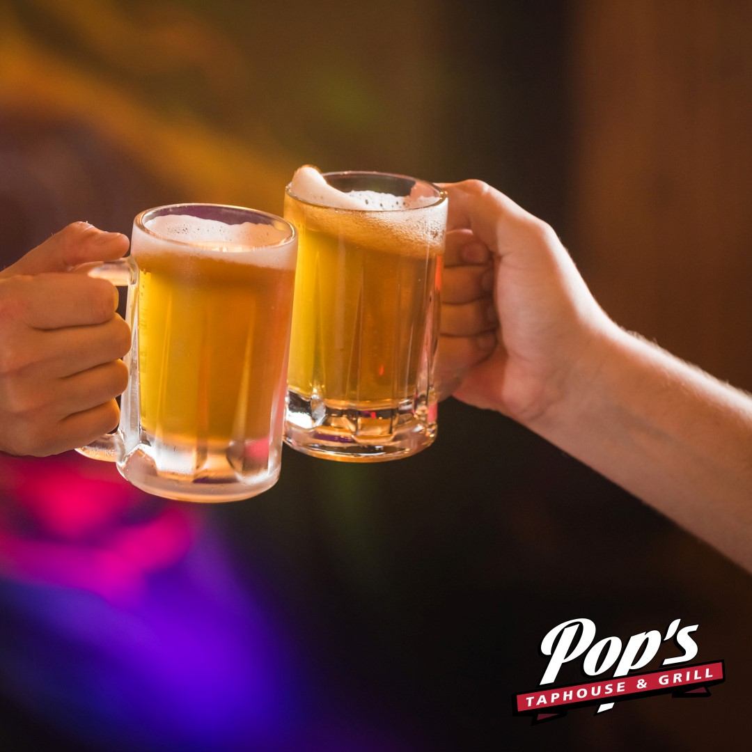 Two people toasting with brews.
