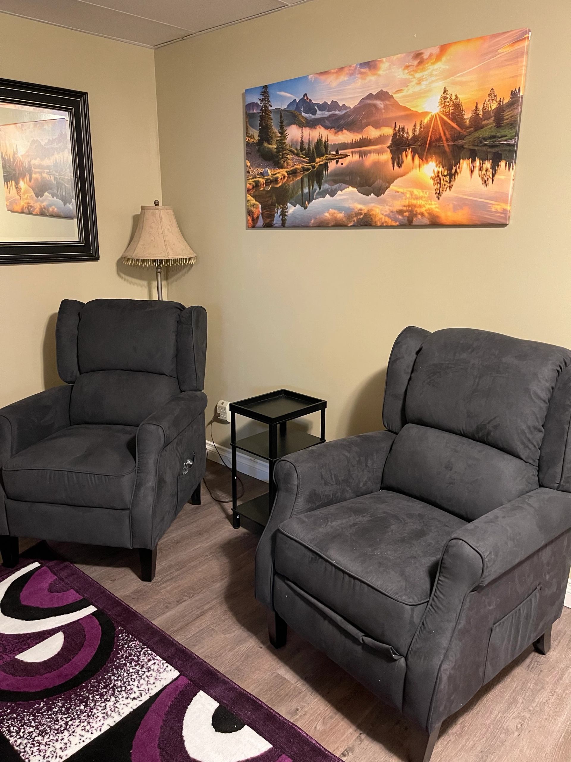 A guest room with two reclining chairs.