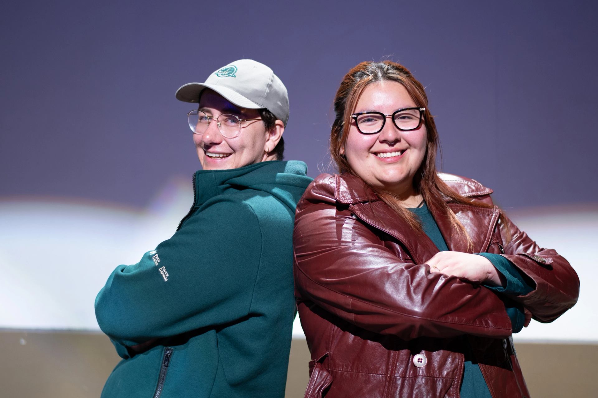 Two of the performers stood back to back with with arms folded in front of them.