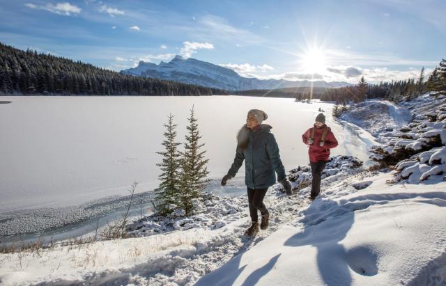 Couple on a winter walk in the Canadian Rockies.