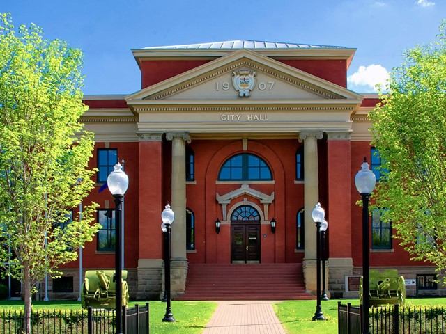 Red brick building with columns and trees at Wetaskiwin VIC.