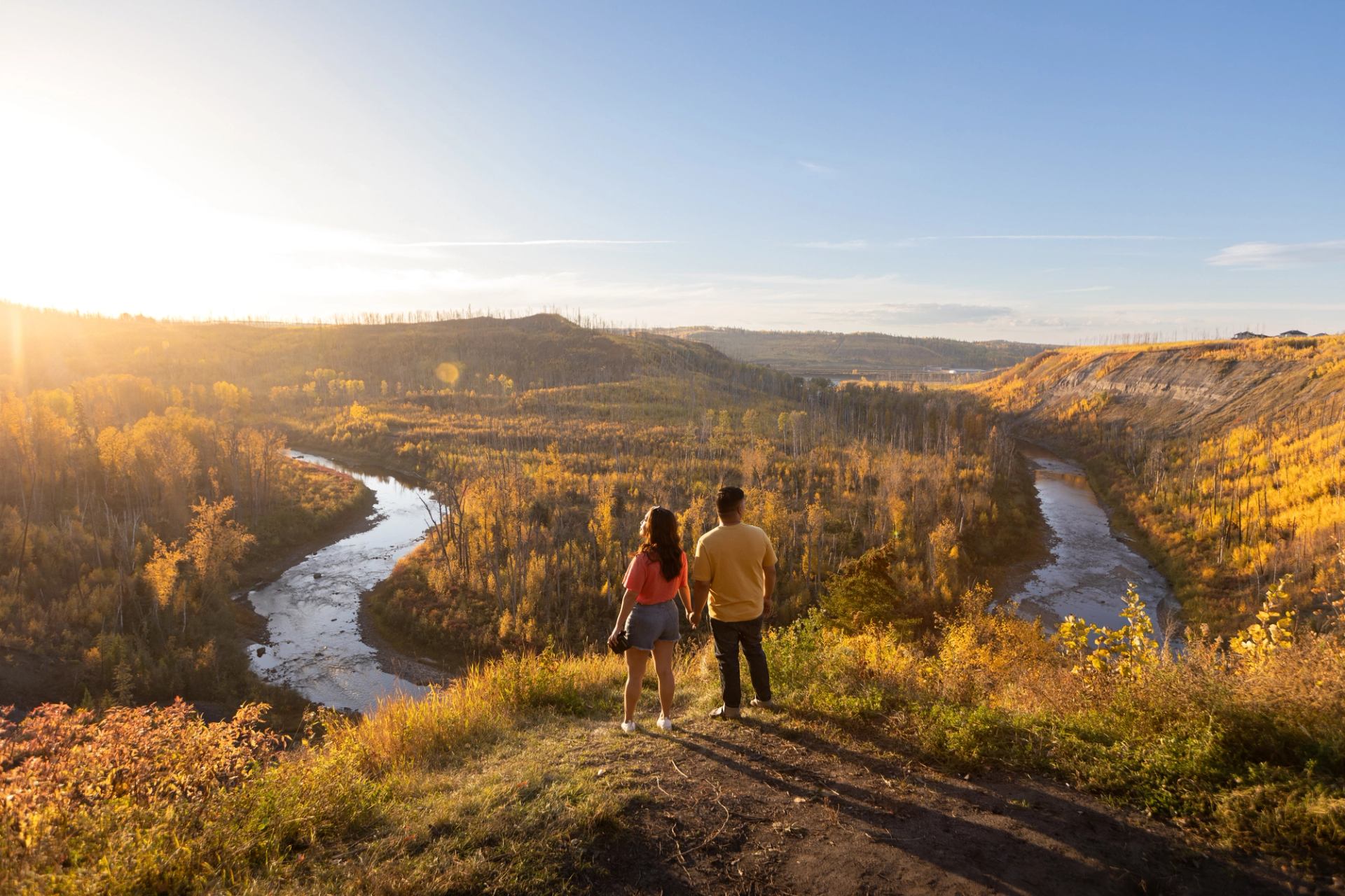 wo people looking over a river lookout near Fort McMurray in Northern Alberta