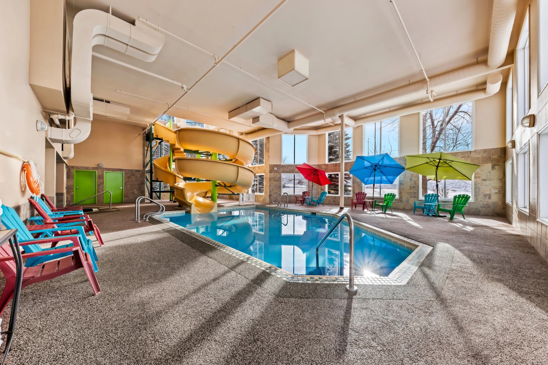 Indoor pool and waterslide at Wingate by Wyndham Calgary.