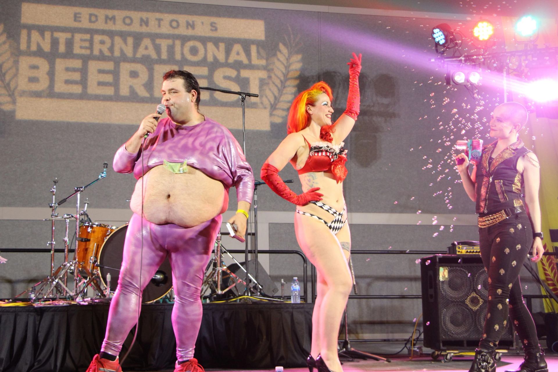 Performers in colorful costumes on stage at Edmonton's International Beerfest.