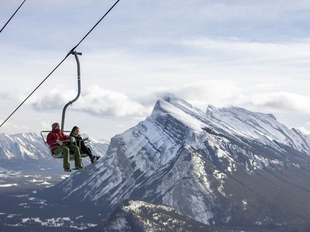 People riding on the Banff Sightseeing Chairlift at Mt Norquay.