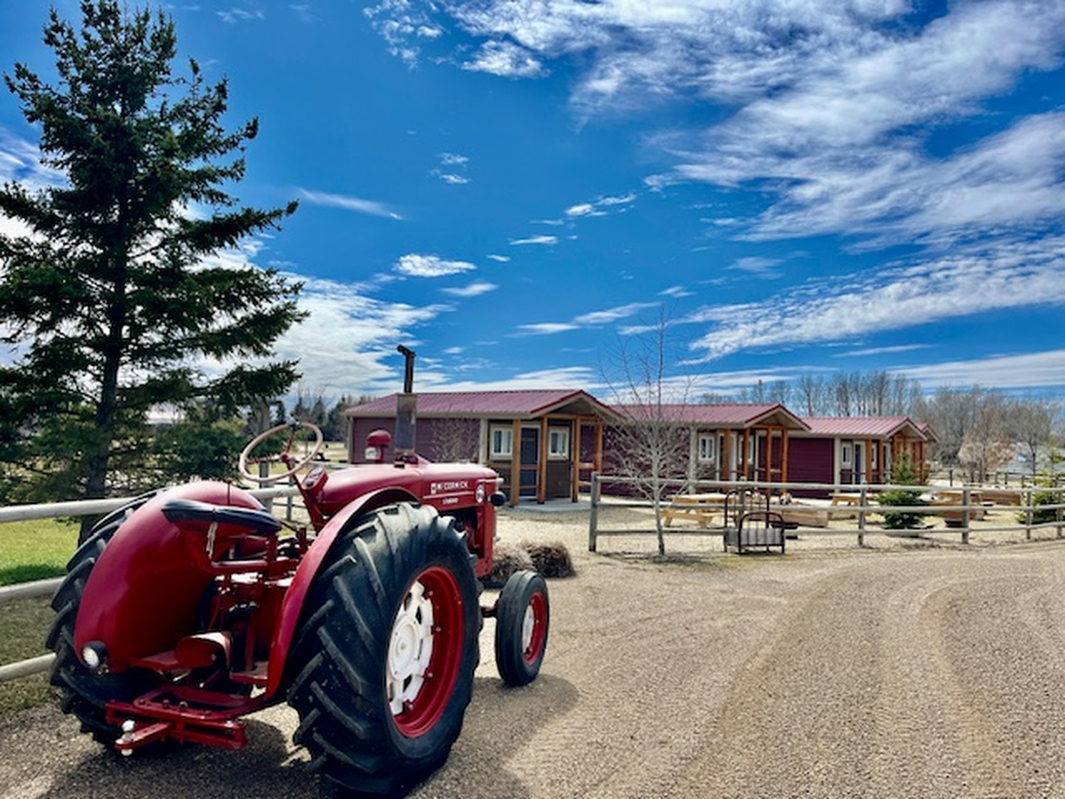 A tractor outside the cabins