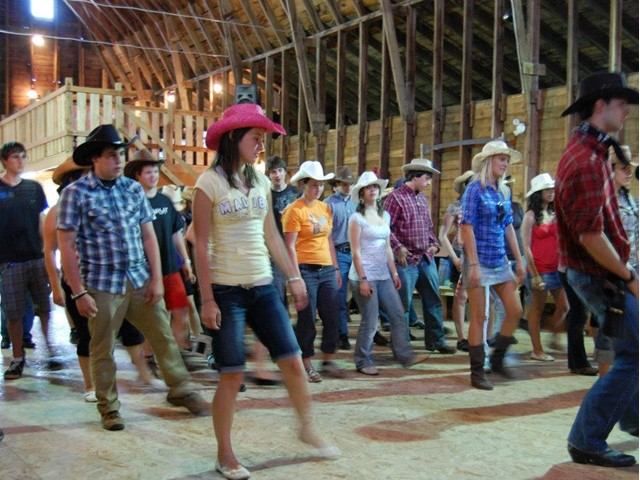 Group of people line dancing.