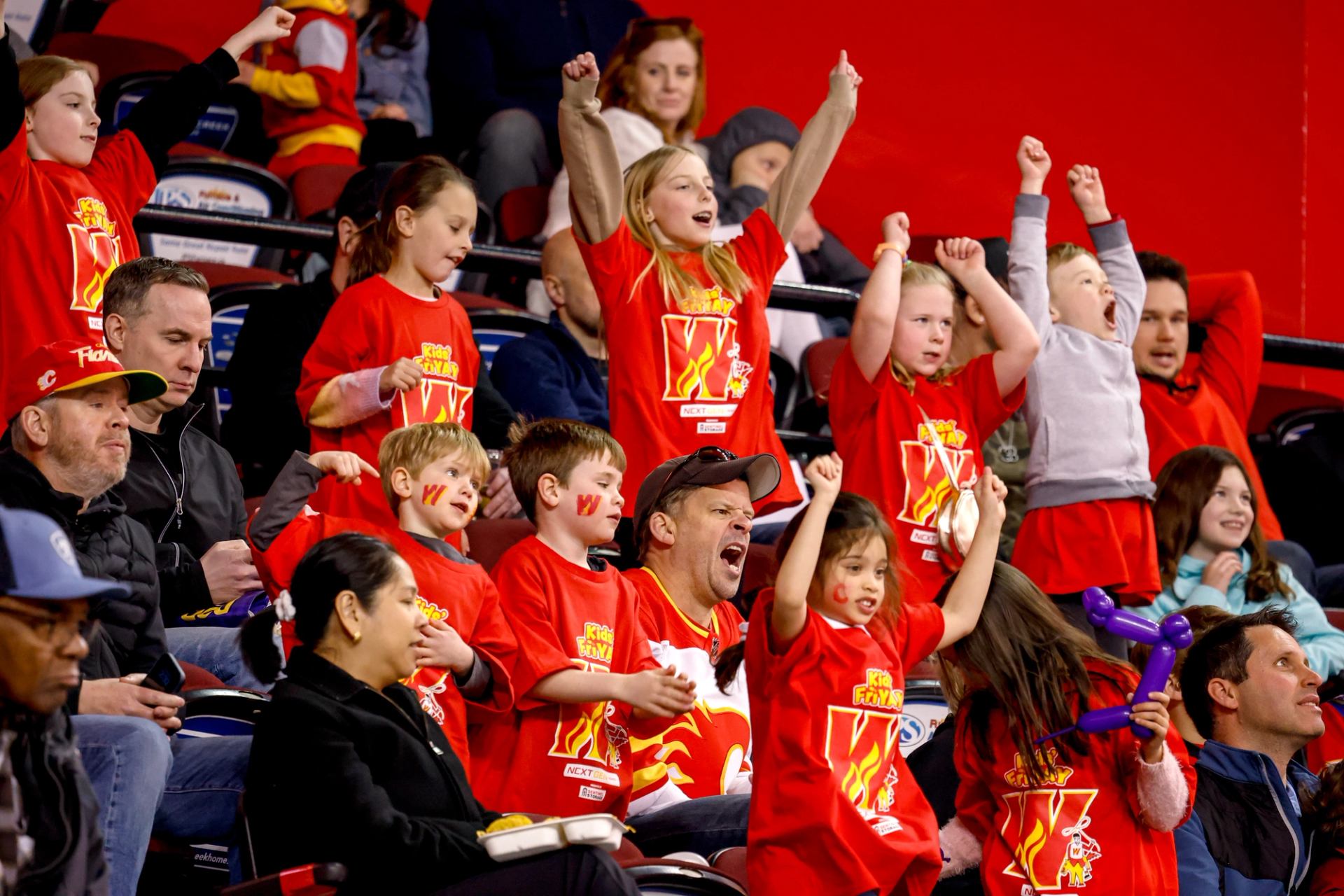 Fans cheering on the game.