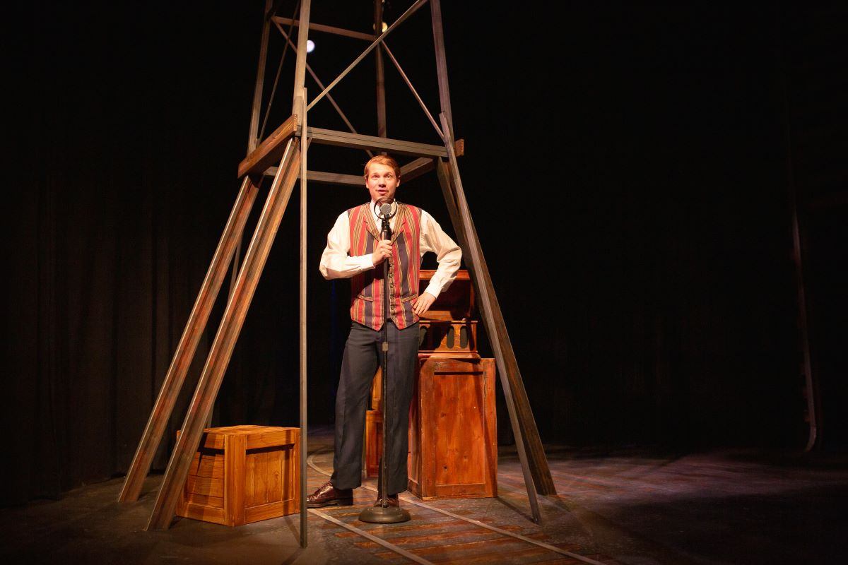 A male performer on the Studio Stage.