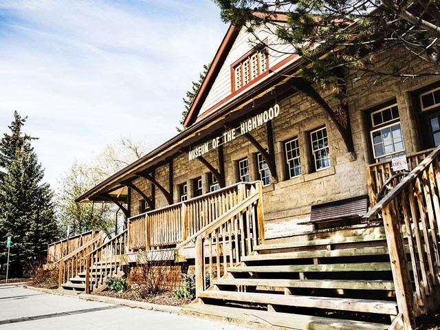 Museum of the Highwood building with wooden exterior and staircase in High River, Alberta.
