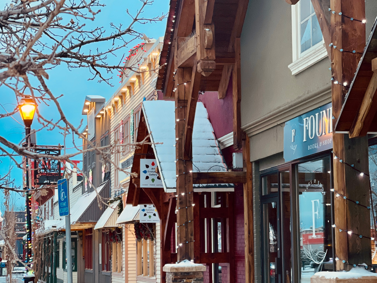 Found bookstore storefront from street view with frosty trees and snow on rooftops