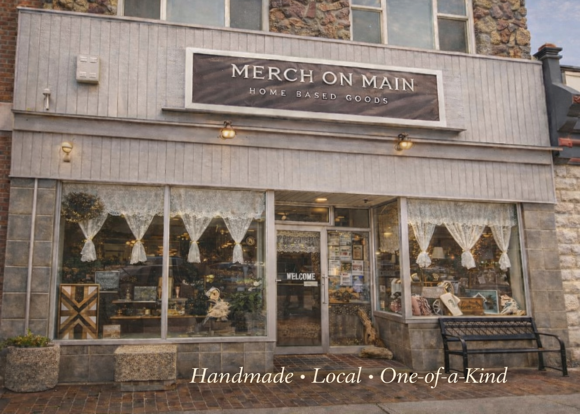 Storefront of Merch on Main home goods shop with decorated display windows and bench.