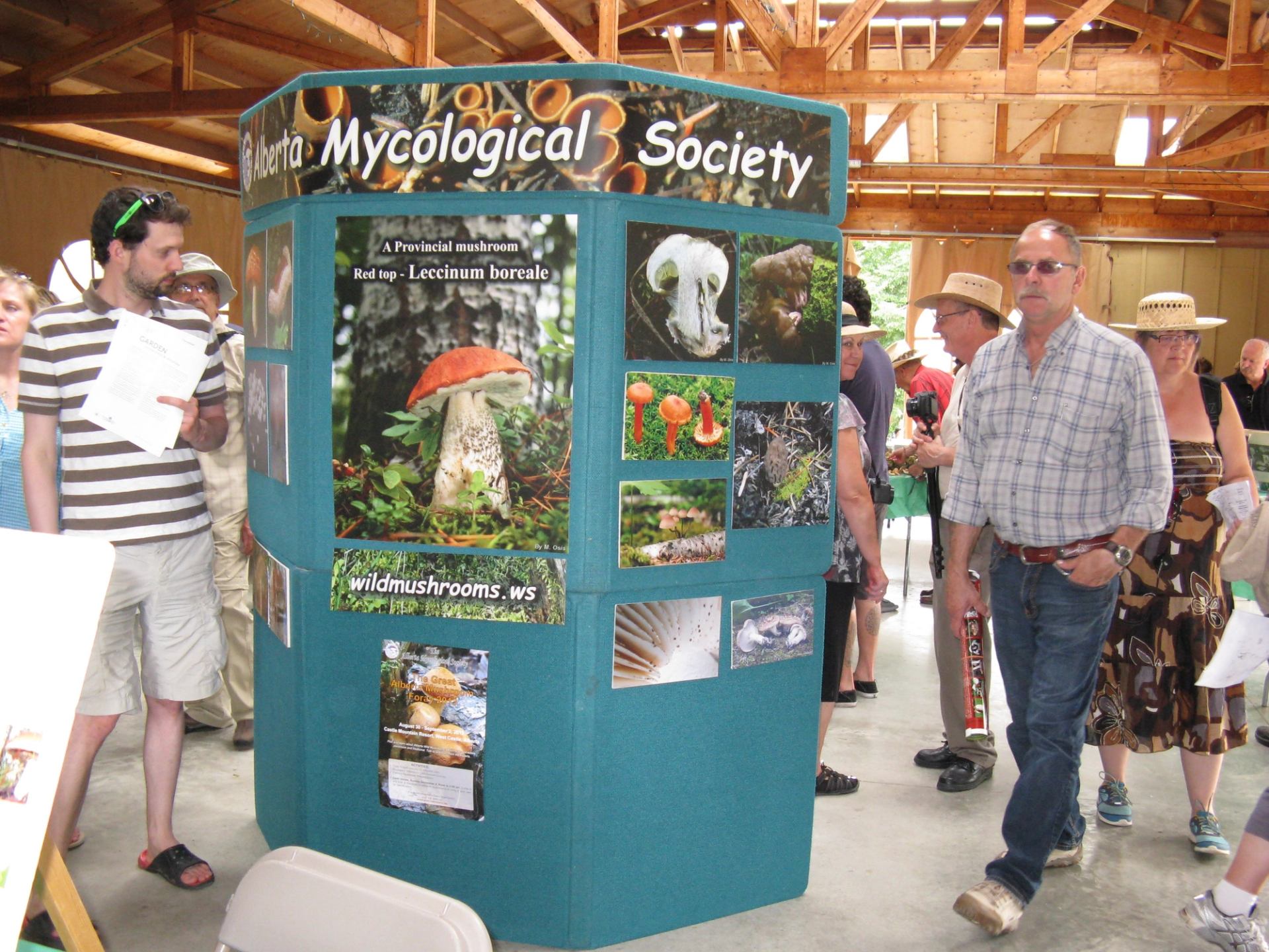 People standing around one of the vendors at the expo