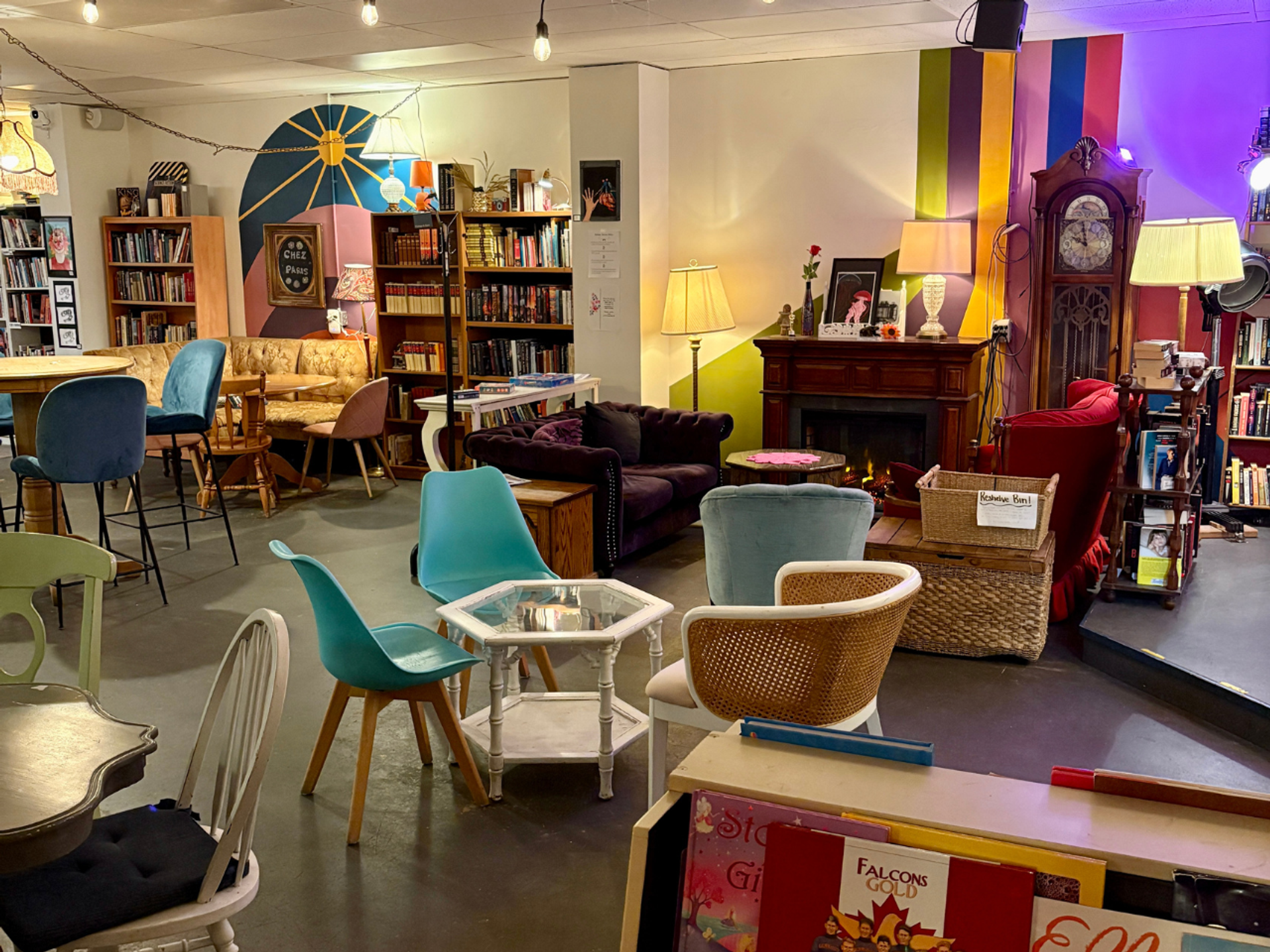 inside Found Books & Shop with living room vibes - lots of comfy seating, walls lined in book shelve