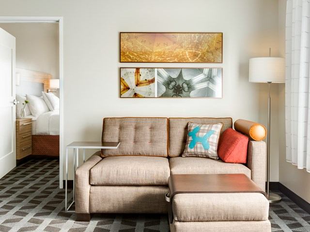 A sofa in the extended stay suite