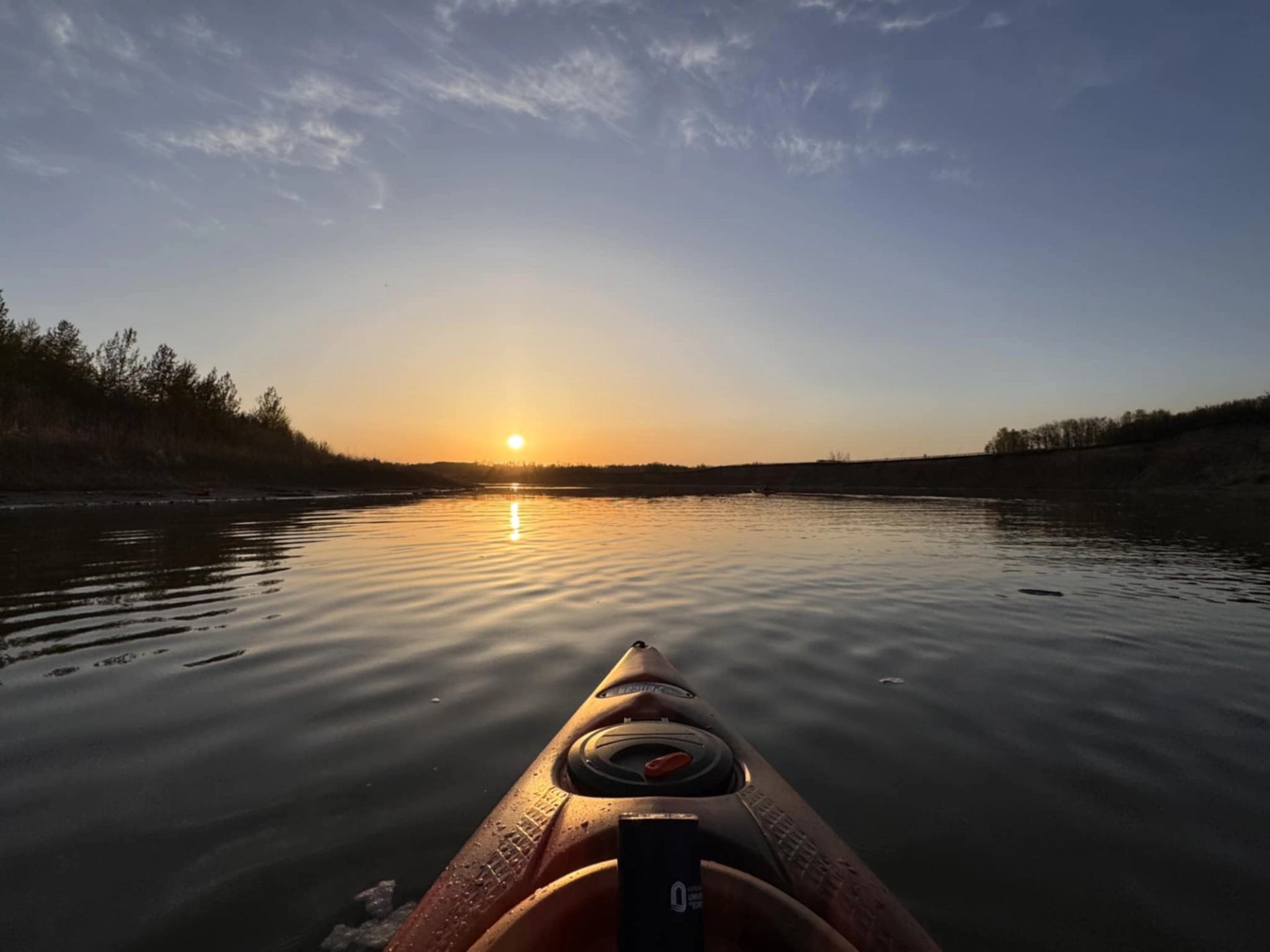 Canoeing at sunset on the lake