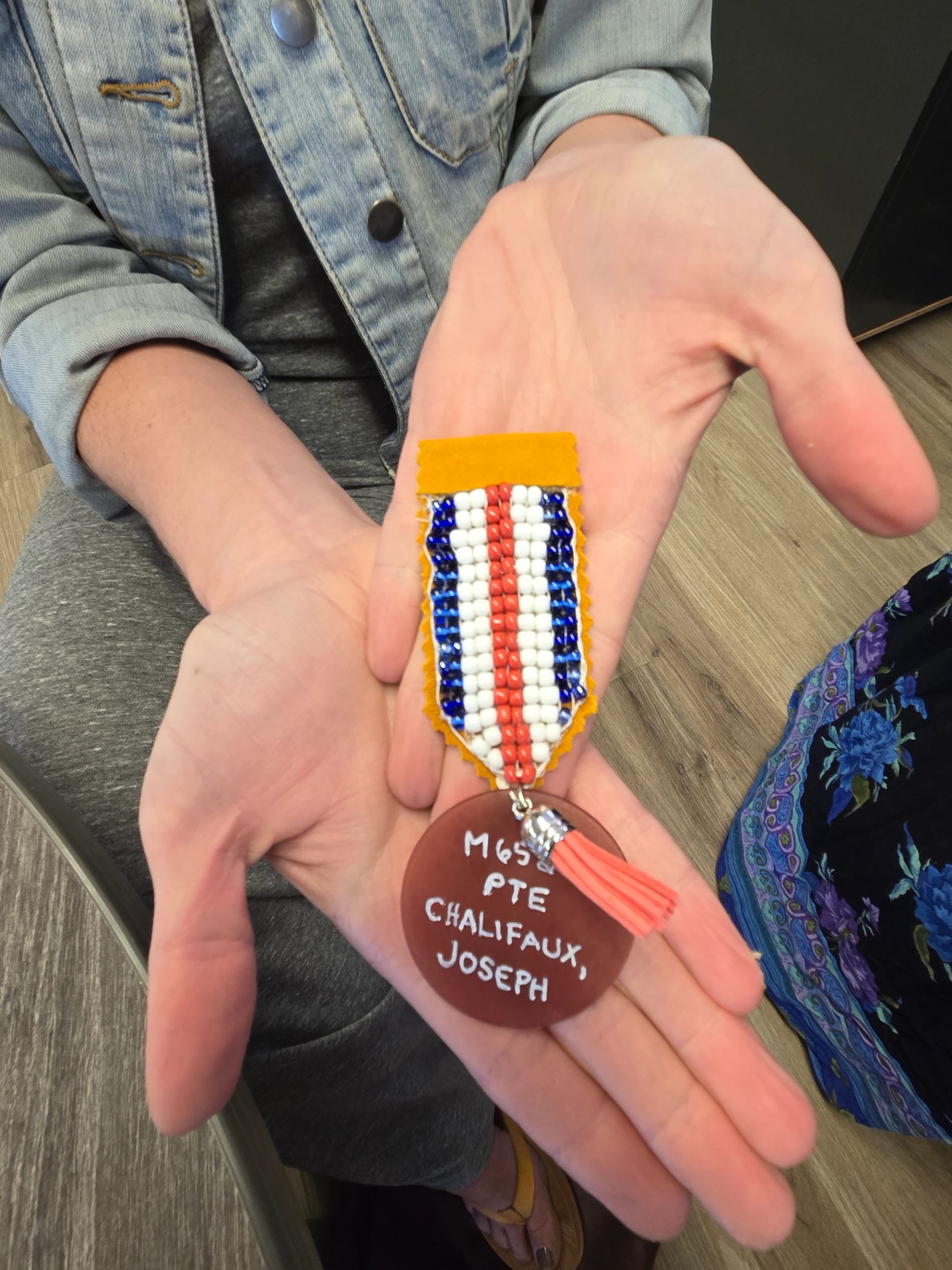 Beaded ribbon with faux dog tag