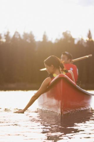 Two people canoeing on Lac Beauvert in Jasper National Park.