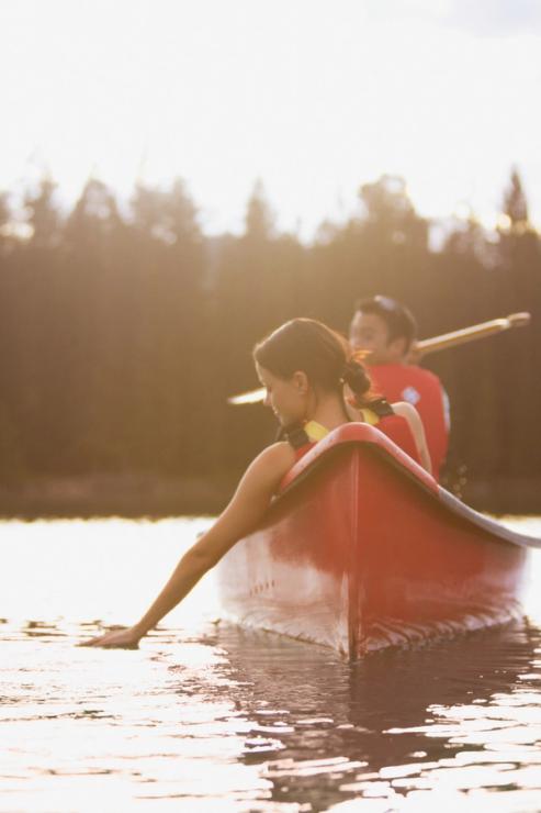 Two people canoeing on Lac Beauvert in Jasper National Park.