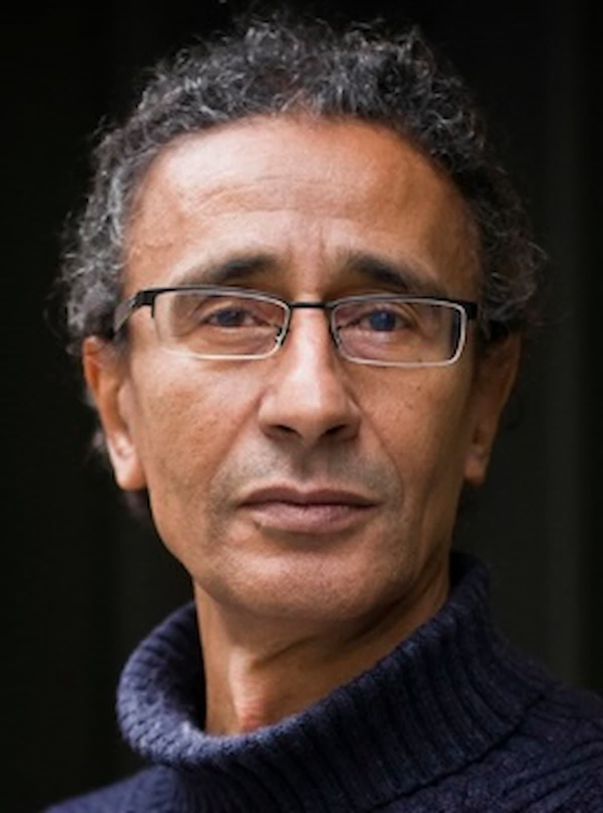 Portrait-style image for Santiago Artozqui, showing a person in a navy knit sweater.