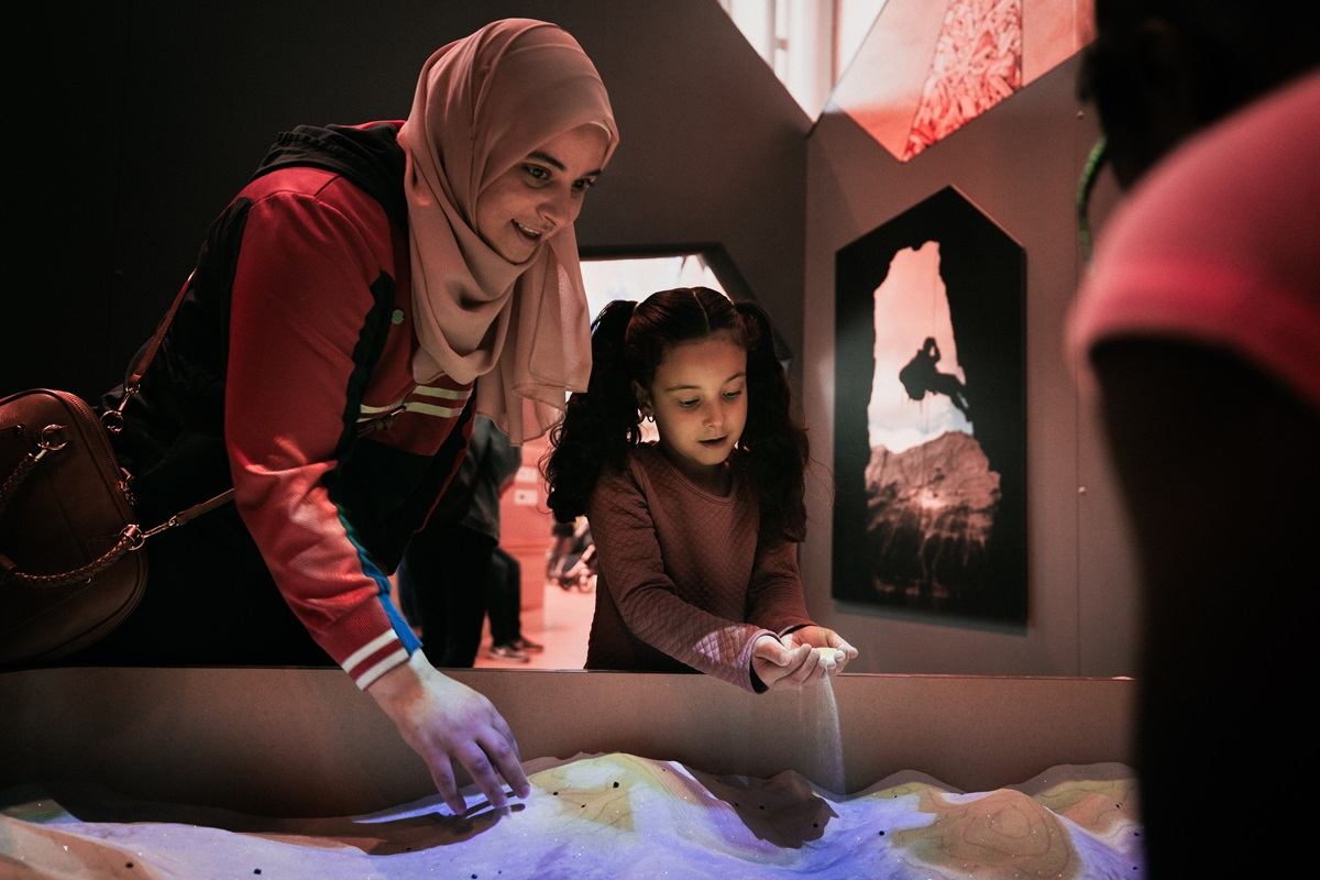 A woman and child looking at an exhibit at RAM.