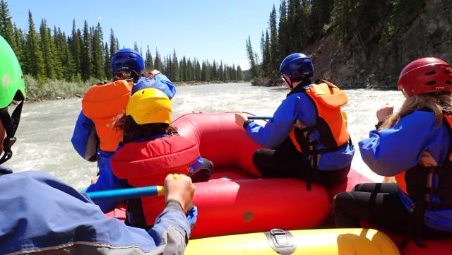 A group of people on a raft tour on the river.