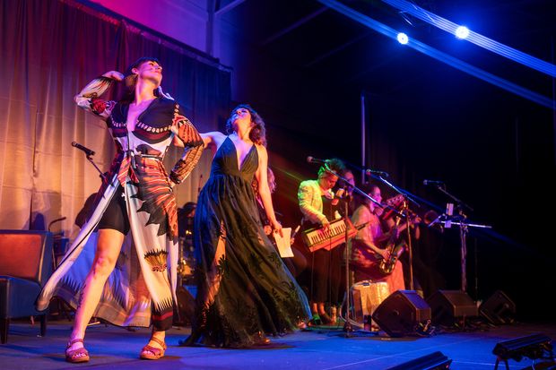 Two fabulously dressed hosts dance to the tunes of the legendary Late Night Cabaret Band.