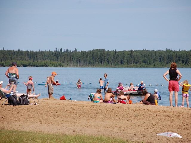 People on the beach and in the water.