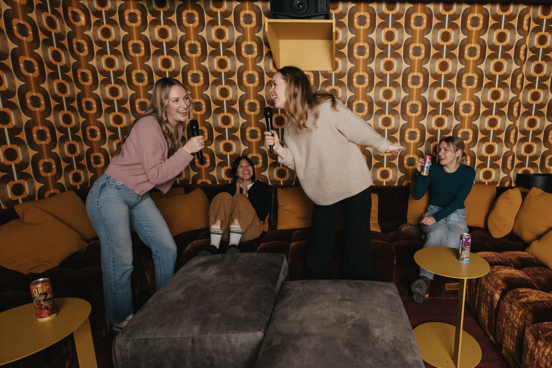 Friends singing karaoke at Moxy Hotel in Banff.