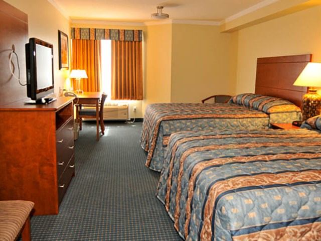 The interior of a two-bed hotel room.