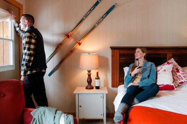 Couple drinking wine inside the Mount Engadine Lodge.