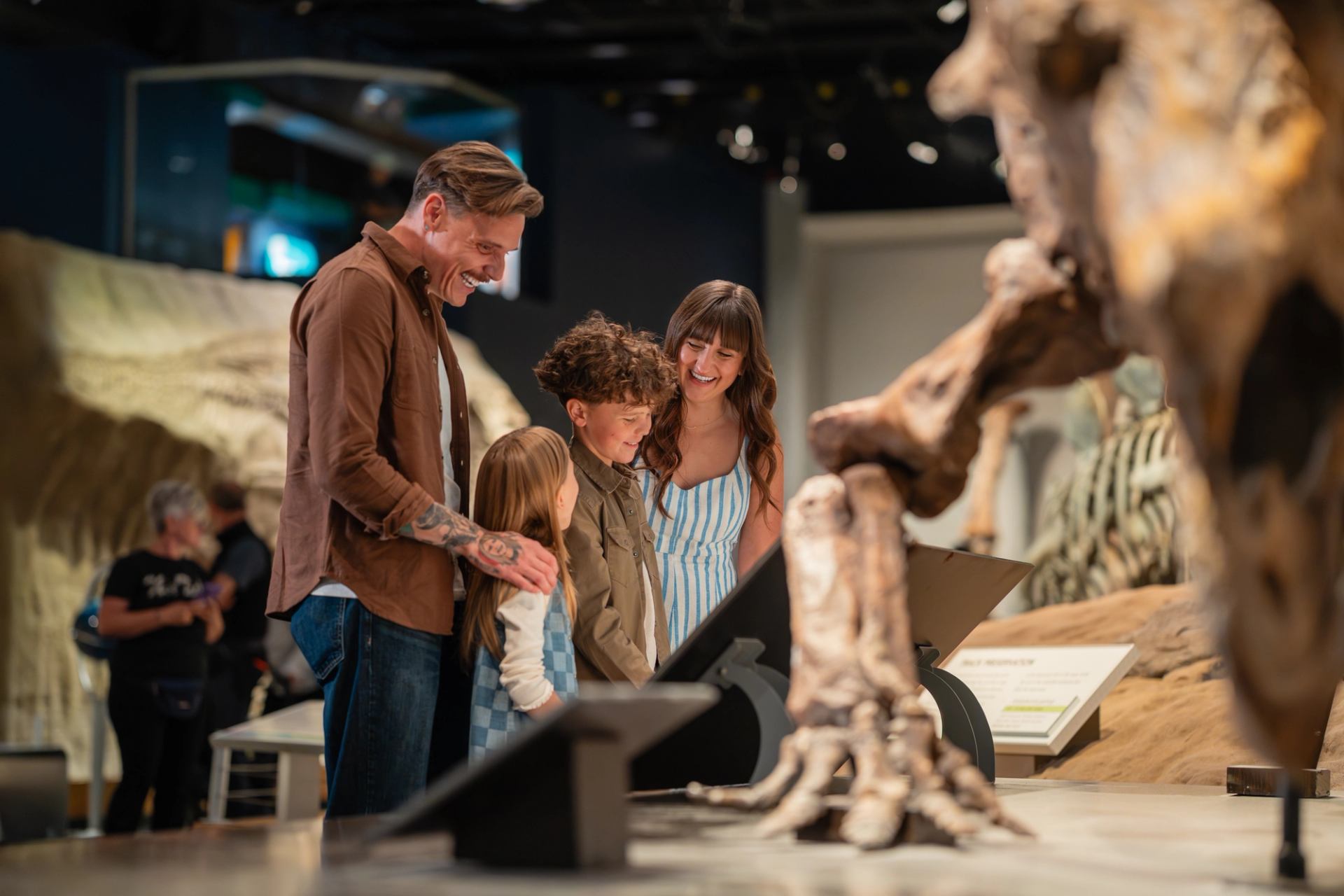 A family look at dinosaur bones at Royall Tyrrell Museum.