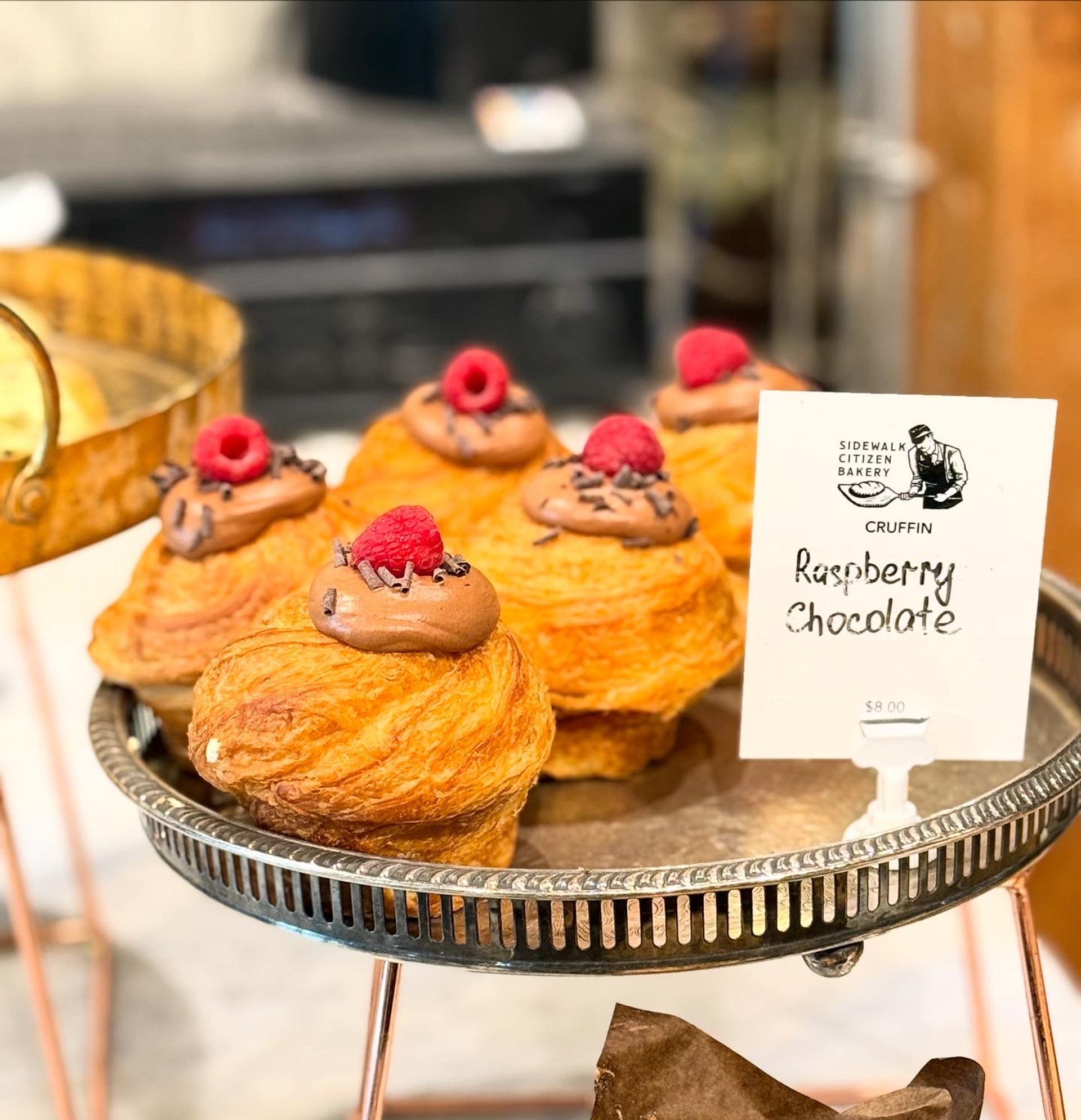 Pastries topped with chocolate and raspberries labeled “Raspberry Chocolatier.