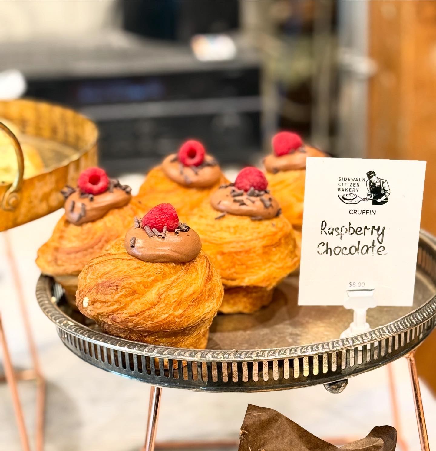 Pastries topped with chocolate and raspberries labeled “Raspberry Chocolatier.