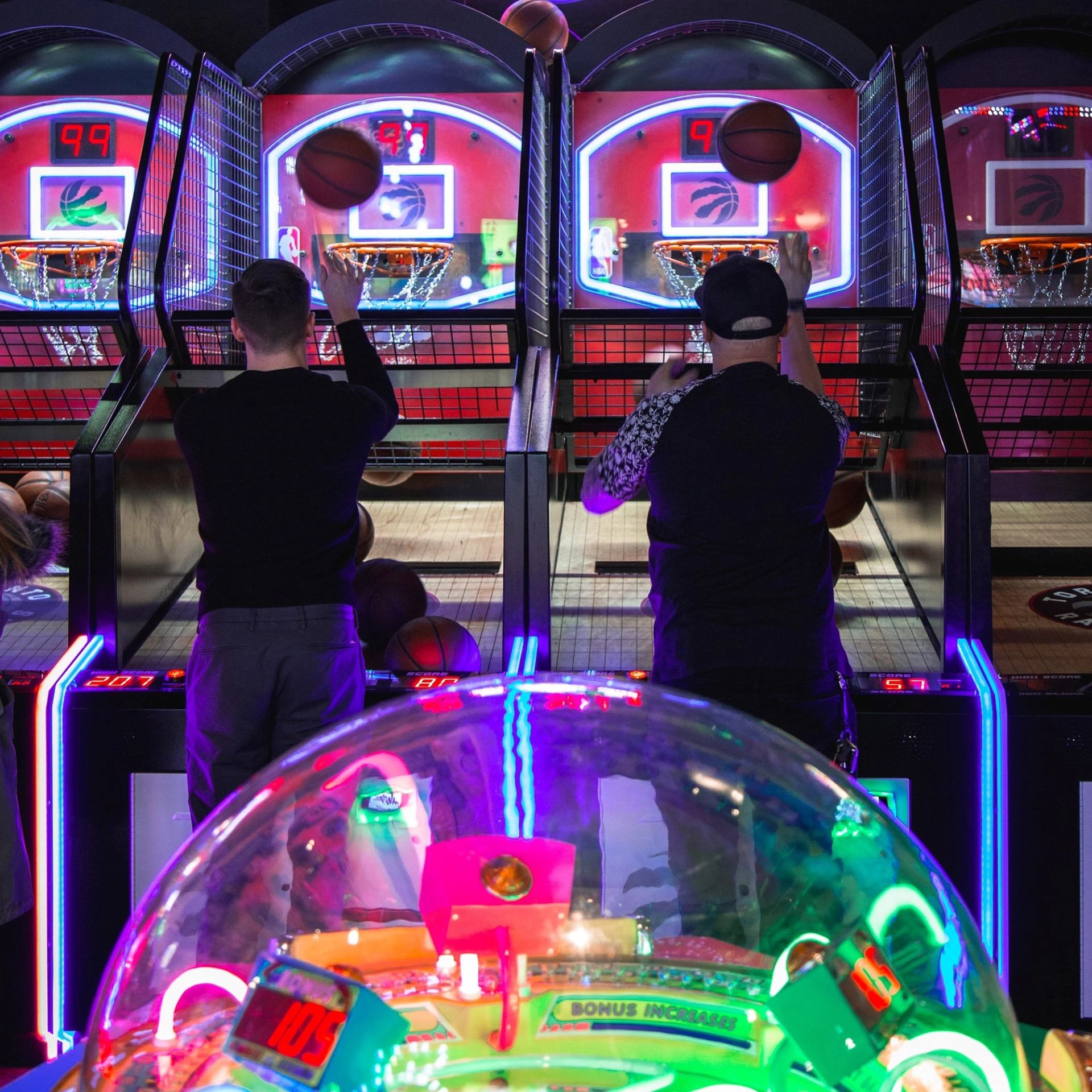 Two people playing a game of basketball