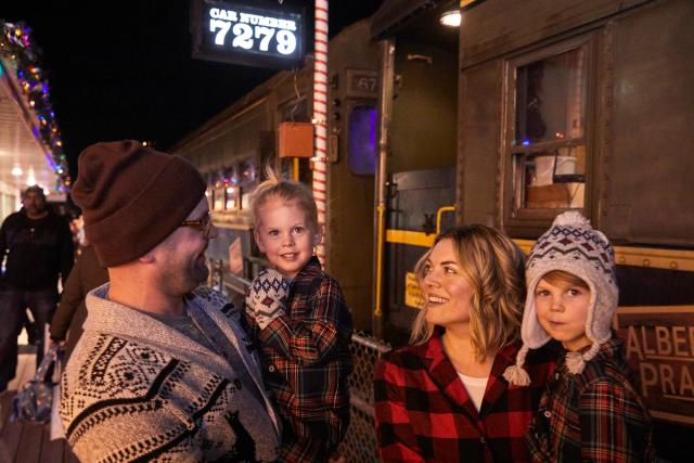 Family on the train platform about to board the Polar Express train ride