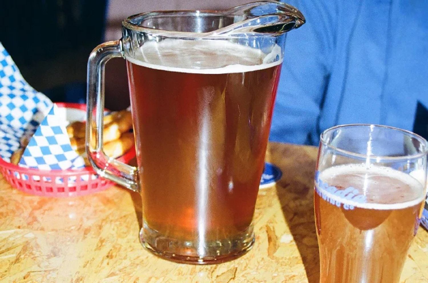 A pitcher of beer with a glass of beer