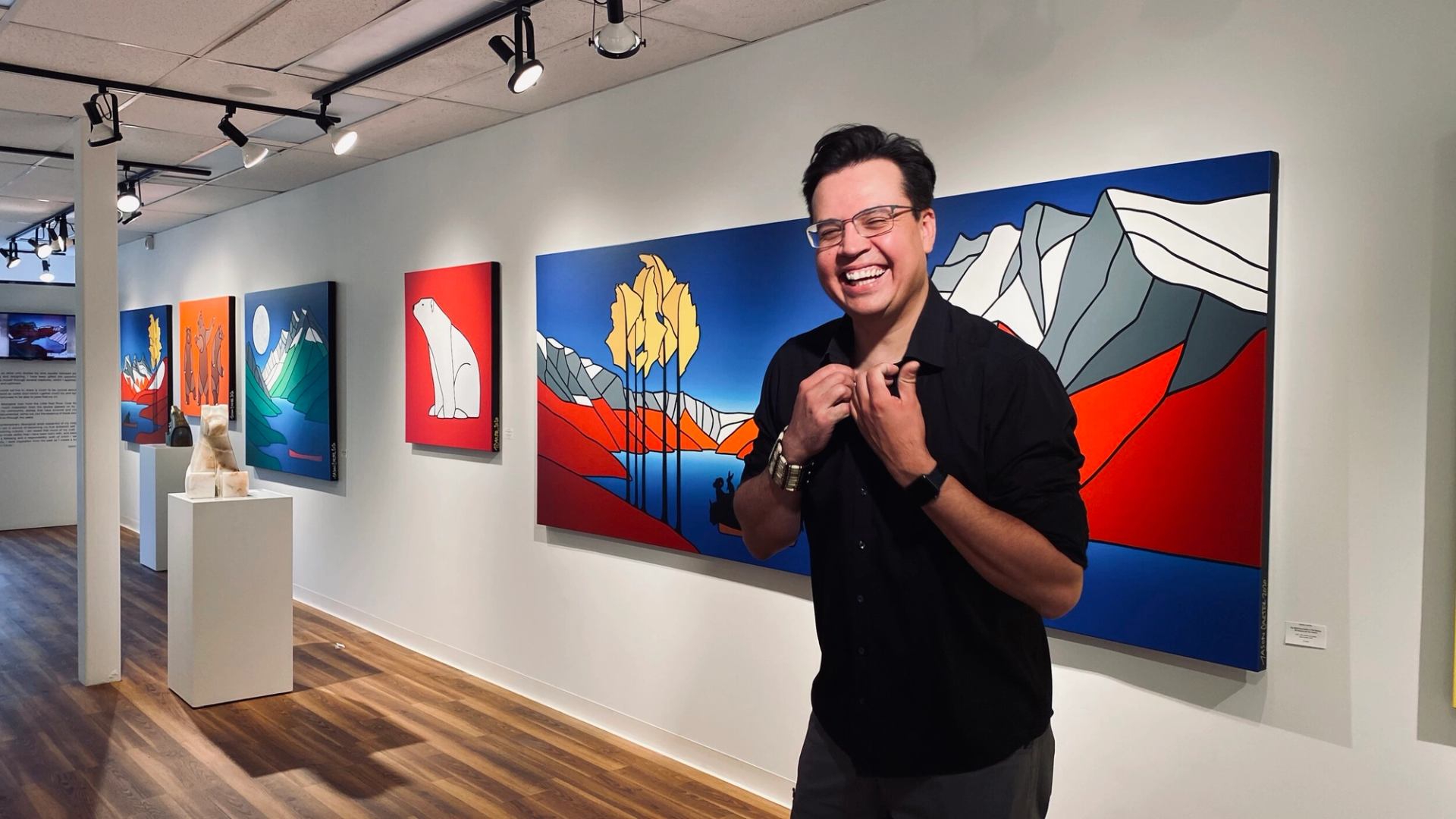 The artist with his art display.