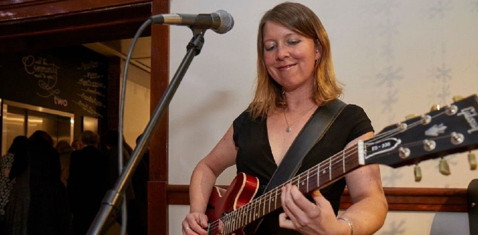 Erin Ross playing guitar
