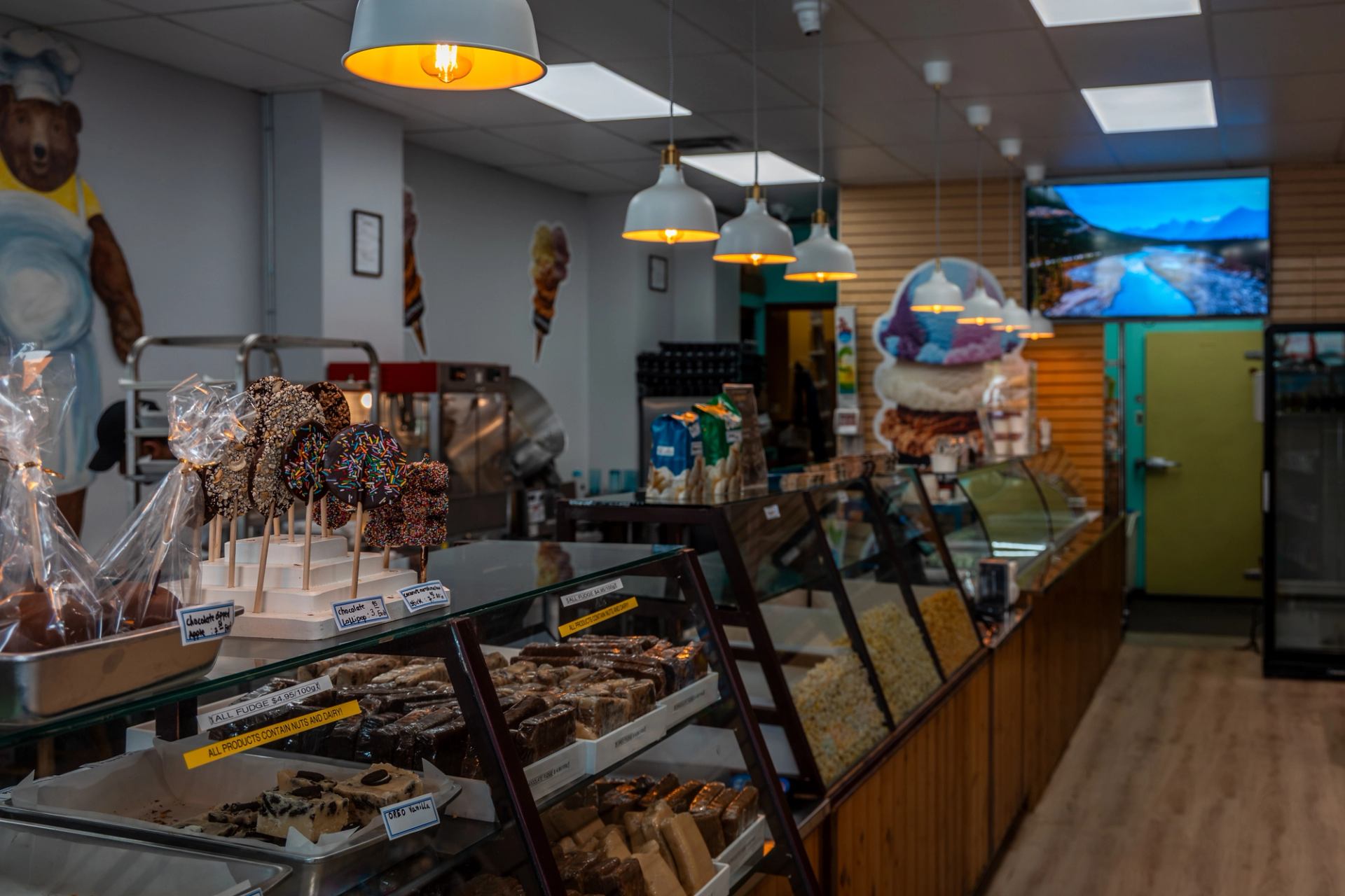 Candy Bear's Lair interior with candies and baked goods on display.