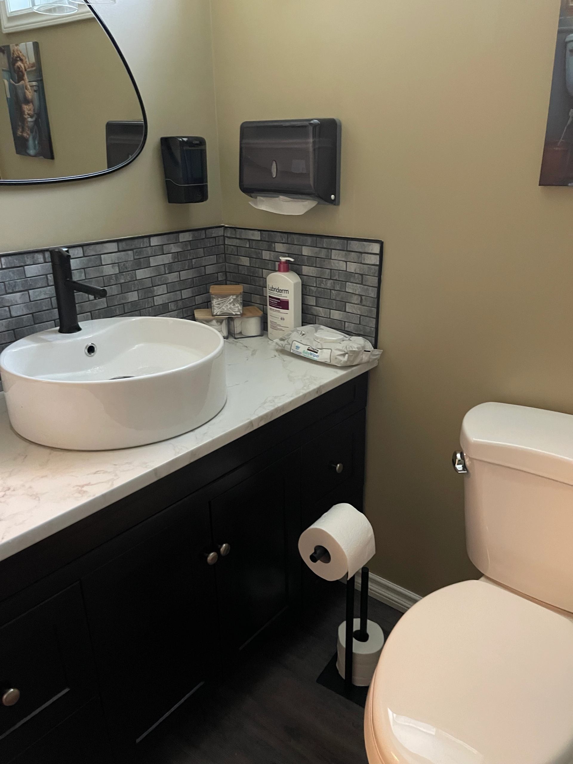 Bathroom vanity and toilet in one the guest rooms.