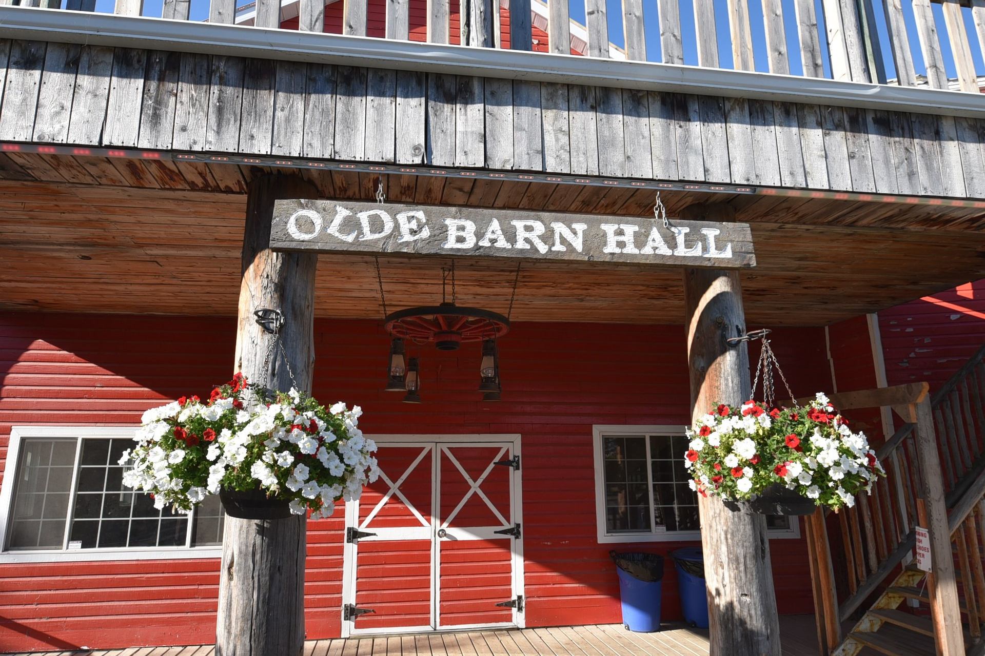 Entrance of Old Barn Hall with hanging flower planters